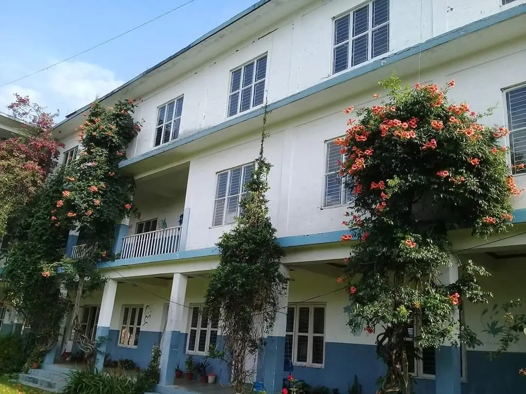 Classroom block with flowering plants