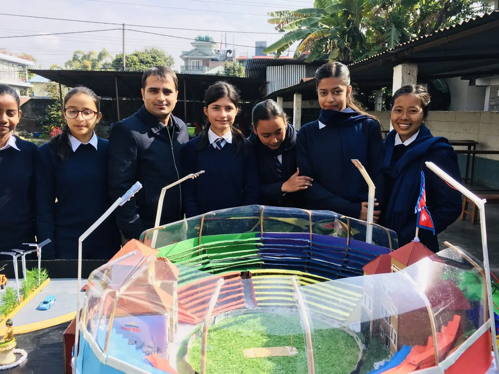 Students presenting a science model